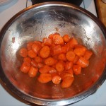 Coating the Cut Carrots with Cumin, Salt and Olive Oil
