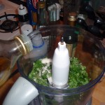 Adding Olive Oil to the Sugar and Mint in the Food Processor